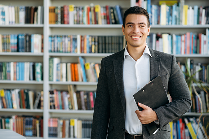 Young man in a suit prepping for a interview
